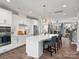 Modern kitchen with white cabinetry, stainless steel appliances, and a spacious island with bar seating at 429 Grey Reagan Trl, Charlotte, NC 28211