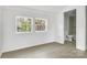 Bright bedroom with access to an ensuite bathroom featuring a view from the double windows at 4501 Knollcrest Dr, Charlotte, NC 28208