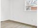 Bright, empty bedroom featuring wood-look floors, a window, and neutral walls at 4501 Knollcrest Dr, Charlotte, NC 28208