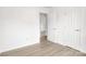 Bright bedroom featuring hardwood floors, a spacious closet, and plenty of natural light at 4501 Knollcrest Dr, Charlotte, NC 28208