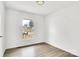 Bright, empty bedroom featuring wood-look floors, a window, and neutral walls at 4501 Knollcrest Dr, Charlotte, NC 28208