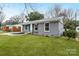 Charming single-story home featuring a freshly painted exterior and a well-maintained front yard at 4501 Knollcrest Dr, Charlotte, NC 28208
