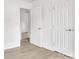 Hallway featuring wood-look floors and neutral walls at 4501 Knollcrest Dr, Charlotte, NC 28208