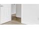 Hallway featuring wood-look floors and neutral walls at 4501 Knollcrest Dr, Charlotte, NC 28208
