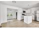 Open concept kitchen with stainless steel appliances, island, and sleek cabinetry at 4501 Knollcrest Dr, Charlotte, NC 28208