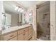 Bathroom featuring a granite vanity and glass shower with tiled walls at 4552 Sawgrass Ct, Denver, NC 28037