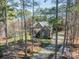 Charming home with a stone and gray facade nestled among tall trees at 4552 Sawgrass Ct, Denver, NC 28037