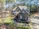 Stunning home featuring red shutters, stone accents, and lush green lawn at 4552 Sawgrass Ct, Denver, NC 28037