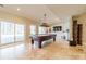Recreation room with a pool table, sliding glass doors, and a built-in entertainment center at 4552 Sawgrass Ct, Denver, NC 28037