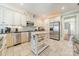 Bright kitchen with an island, stainless steel appliances, and tile flooring at 4552 Sawgrass Ct, Denver, NC 28037