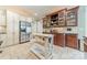 Kitchen featuring stainless steel appliances, tile flooring, and a kitchen island at 4552 Sawgrass Ct, Denver, NC 28037