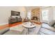 Cozy living room featuring a stone fireplace, hardwood floors, and stylish furnishings at 4552 Sawgrass Ct, Denver, NC 28037