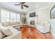 Cozy living room featuring a fireplace and natural light at 4552 Sawgrass Ct, Denver, NC 28037