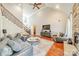 Bright living room showcasing a high ceiling, hardwood floors, and elegant furnishings at 4552 Sawgrass Ct, Denver, NC 28037
