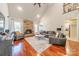 Inviting living room with a stone fireplace, hardwood floors, and comfortable seating at 4552 Sawgrass Ct, Denver, NC 28037
