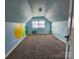 Bright bedroom with playful wall art and neutral carpet flooring at 4723 Doris Ave, Charlotte, NC 28205