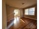 Cozy living room with hardwood floors and ample sunlight at 4723 Doris Ave, Charlotte, NC 28205