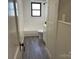 Bathroom featuring white tile, a sink, and a window at 5135 Tucker Ave, Kannapolis, NC 28081