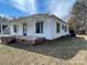 Charming home with white siding, green shutters, and a welcoming front porch at 5135 Tucker Ave, Kannapolis, NC 28081