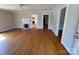 Bright living room with hardwood floors and white fireplace at 5135 Tucker Ave, Kannapolis, NC 28081