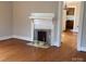 Bright living room featuring a decorative fireplace and hardwood floors at 5135 Tucker Ave, Kannapolis, NC 28081