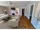 Virtual staging presents a bright living room featuring neutral furniture, fireplace and open entryways at 5135 Tucker Ave, Kannapolis, NC 28081