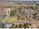 Aerial view of home showcasing the surrounding trees and greenery in a quiet neighborhood setting at 528 Sherrill Ave, Lincolnton, NC 28092
