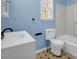 Cozy bathroom featuring a toilet, sink, and tub with modern hardware at 528 Sherrill Ave, Lincolnton, NC 28092