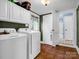 Functional laundry room featuring a washer, dryer, and ample storage at 528 Sherrill Ave, Lincolnton, NC 28092
