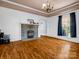 Spacious living room with hardwood floors, fireplace and large window at 528 Sherrill Ave, Lincolnton, NC 28092