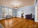 Bright room with hardwood floors, a decorative ceiling, and large windows at 528 Sherrill Ave, Lincolnton, NC 28092