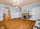 Living room with a decorative brick fireplace, and hardwood floors at 528 Sherrill Ave, Lincolnton, NC 28092