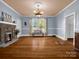 Bright room boasting a decorative fireplace, hardwood floors, and elegant ceiling fixture at 528 Sherrill Ave, Lincolnton, NC 28092