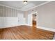 Room features hardwood floors, white trim, and sports-themed decor at 528 Sherrill Ave, Lincolnton, NC 28092