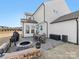 Backyard patio area with a fire pit, grill and outdoor seating; perfect for entertaining at 702 Yucatan Dr, Waxhaw, NC 28173