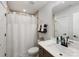 Bright bathroom features a white shower curtain and a vanity with white countertop at 702 Yucatan Dr, Waxhaw, NC 28173