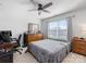 Bedroom with a desk, chair, and dresser for storage at 702 Yucatan Dr, Waxhaw, NC 28173