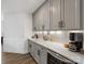 Butler pantry featuring gray cabinetry, subway tile backsplash, and quartz countertops at 702 Yucatan Dr, Waxhaw, NC 28173