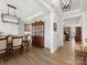 Elegant dining room with tray ceiling, modern lighting, and stylish furniture, open to living spaces at 702 Yucatan Dr, Waxhaw, NC 28173