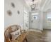 Bright foyer featuring hardwood floors, decorative lighting, and a charming bench at 702 Yucatan Dr, Waxhaw, NC 28173