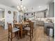 Spacious kitchen with gray cabinetry, stainless steel appliances, and a large island with seating at 702 Yucatan Dr, Waxhaw, NC 28173