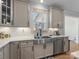 Close-up view of a kitchen with a stainless steel sink and ample countertop space at 702 Yucatan Dr, Waxhaw, NC 28173