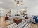 Spacious living room with comfortable seating and hardwood floors, perfect for entertaining at 702 Yucatan Dr, Waxhaw, NC 28173