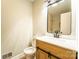 Updated bathroom featuring modern vanity, stylish mirror, and tiled shower for a spa-like experience at 7231 Lockmont Dr, Charlotte, NC 28212