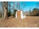 Exterior shot of white shed with brown trim at 7231 Lockmont Dr, Charlotte, NC 28212