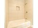 Modern shower with sleek tiles, built-in niche, and stylish fixtures, offering a refreshing experience at 7231 Lockmont Dr, Charlotte, NC 28212