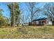 Expansive backyard of the brick home with mature trees at 801 Requa Rd, Cherryville, NC 28021