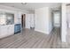 Updated kitchen featuring granite countertops and white cabinets, with easy access to living areas for entertaining at 801 Requa Rd, Cherryville, NC 28021