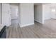 Efficiently designed kitchen with granite countertops, opening into the bright living area with new gray flooring at 801 Requa Rd, Cherryville, NC 28021