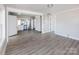Spacious living room with new gray flooring and ample natural light, adjacent to a bright and modern kitchen at 801 Requa Rd, Cherryville, NC 28021